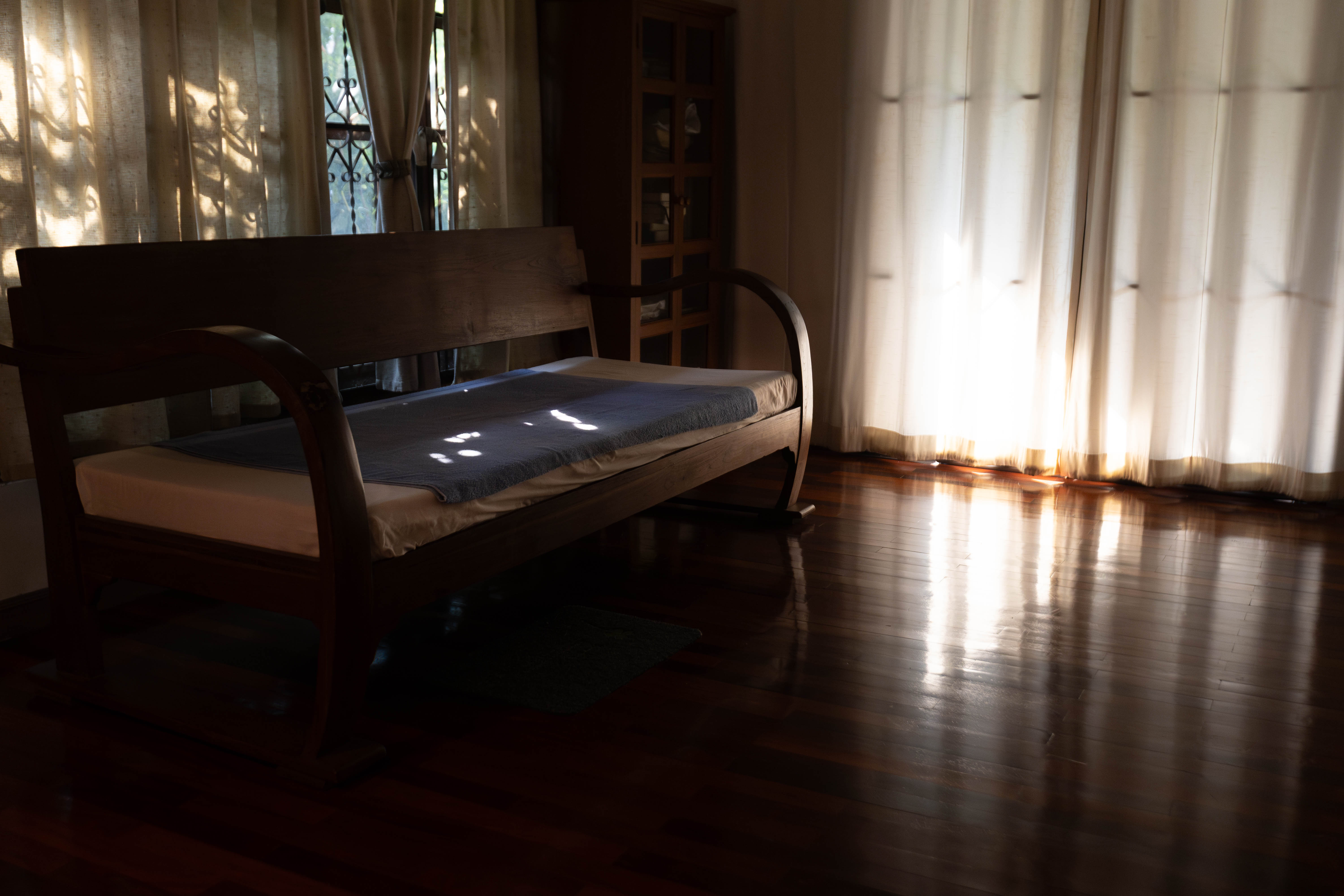 A bed in a darkened room